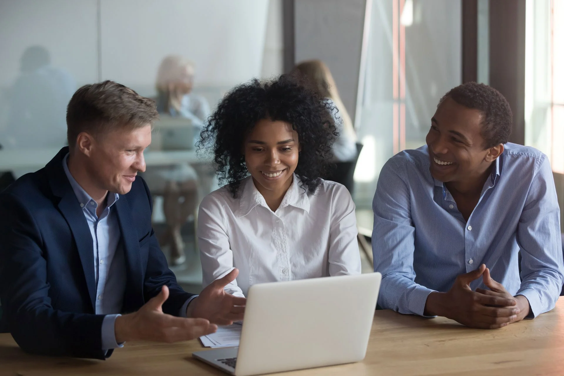 A consulting team reviewing customer experience data together